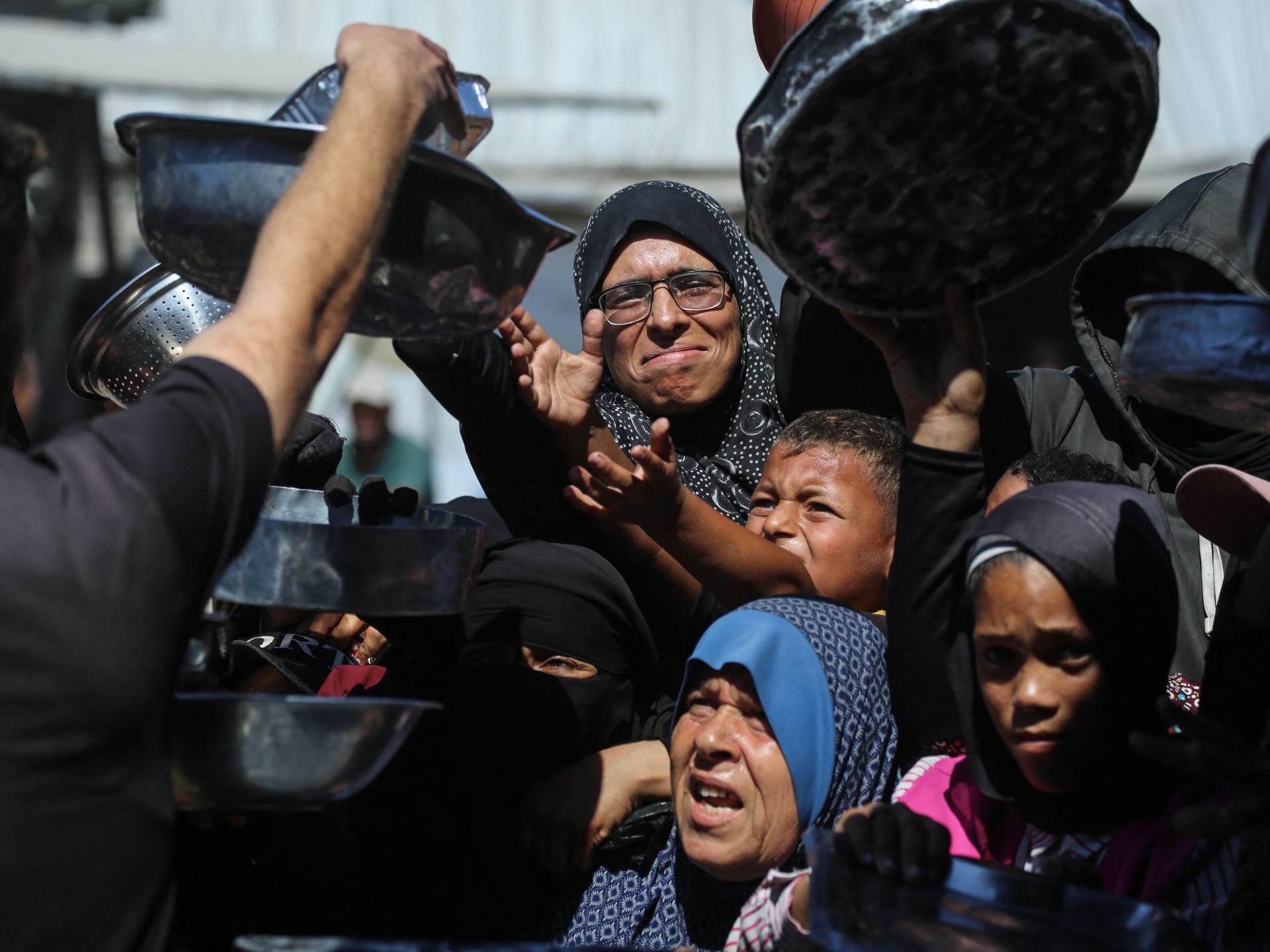 Photos: Gaza mothers endure endless lines as famine fears persist